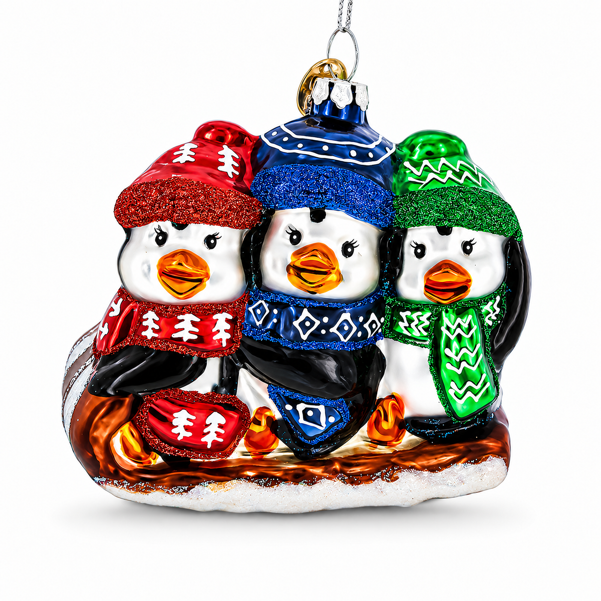 Penguin Trio Sledding Glass Christmas Ornament